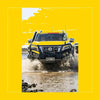 Yellow nissan navara np300 with black steel rockarmor gt hoop bullbar full bar replacement and roof rack