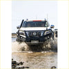 White nissan st-30 pickup with black steel rockarmor gt hoop bullbar front bumper guard and roof rack
