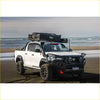 White toyota hilux ute with black steel rockarmor gt hoop bullbar and rooftop tent for offroad 4wd adventures