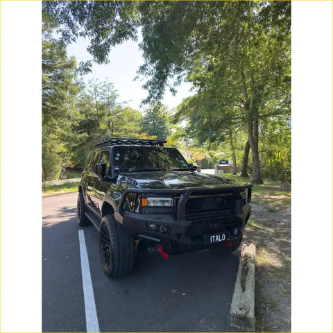 Black rugged steel rockarmor gt hoop bullbar with roof rack and front bumper guard on toyota prado 250 2024