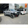 Silver toyota hilux ute with black steel rockarmor gt hoop bullbar and offset branding for offroad 4wd use