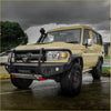 Beige toyota land cruiser 70 with black steel rockarmor gt bullbar and roof snorkel for offroad 4wd use