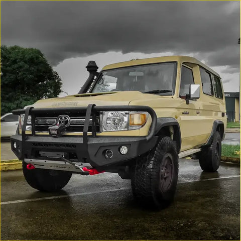 Beige toyota land cruiser 70 with black steel rockarmor gt bullbar and roof snorkel for offroad 4wd use