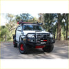 White toyota hilux 4wd ute with black rockarmor premium bullbar, red alloy wheels, and offroad roof rack accessories