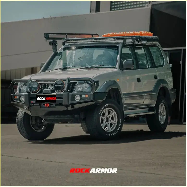 Silver toyota land cruiser with black rockarmor steel bullbar and roof rack perfect for offroad 4wd and ute use