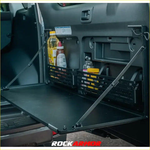 Black metal foldable truck bed organizer with mesh side panels and adjustable arms for toyota prado 150 rear door view