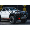 Black and silver ford ranger wildtrak off-road truck with gt hoop bullbar rugged tires and rock sliders