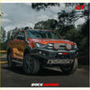 Orange isuzu dmax pickup with black rockarmor gt hoopless bullbar front bumper and round led lights
