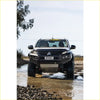 Black mitsubishi triton pickup with gt hoopless bullbar and rock sliders from rockarmor rock pack for off-road use