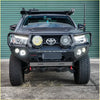 Black toyota tacoma with heavy-duty front bumper and two led light pods in rockarmor rock pack bullbar and rock sliders