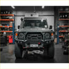 Dark gray toyota land cruiser 70 with rugged gt hoop bullbar and rock sliders from rockarmor rock pack 2023+