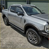 Silver ford ranger ute with black rockarmor steel rockslider side steps and rugged tires for offroad 4wd use
