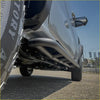 Black tubular steel rockarmor rockslider side steps on silver ford ranger nextgen 22+ ute for offroad 4wd protection