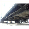Black steel rockarmor rockslider side steps shown on the underside of a 4wd ute with visible exhaust and suspension parts