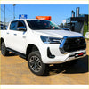 White toyota hilux ute with black grille and rockarmor steel rockslider side steps for offroad 4wd n90 2026+