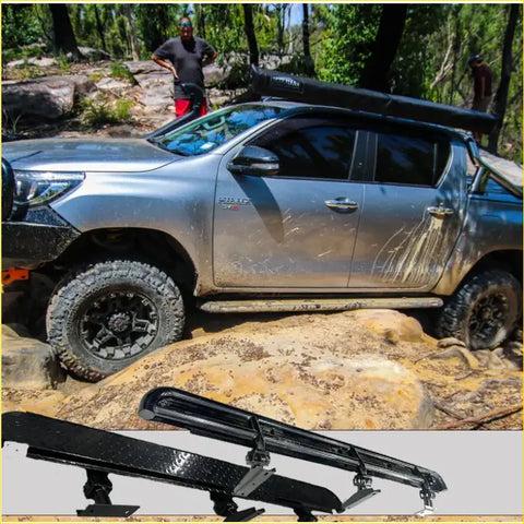 Black carbon fiber rockarmor steel rockslider side steps with textured finish and integrated brackets for toyota hilux n90 4wd ute offroad