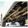 Chrome exhaust system with black metal brackets and rusted catalytic converter on rockarmor steel rockslider side steps for toyota hilux n90 4wd ute offroad