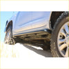 Black steel rockarmor rockslider side step mounted on silver toyota landcruiser 200 series 4wd ute for offroad use