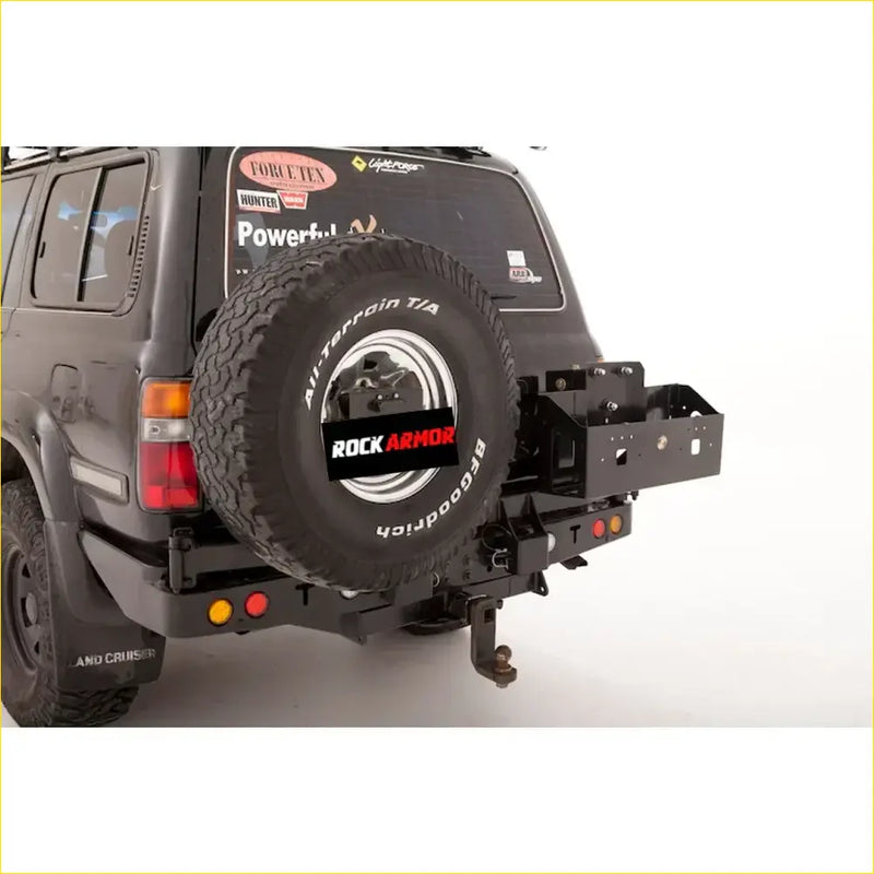 Black rockarmor twin jerry can holder with lock and spare tire rack in rugged metal for offroad 4wd ute use