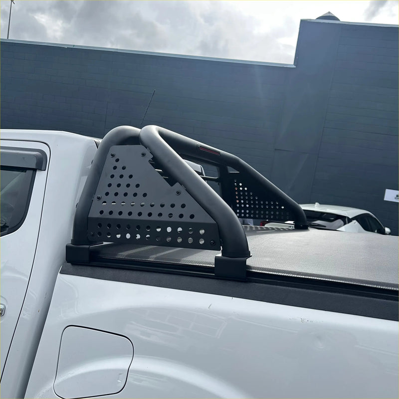 Black perforated metal roll bar with curved tubular bars and mounting brackets for mazda bt-50 2021+ truck bed rail