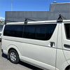 White van with black heavy duty roof rack 3 piece set and tinted windows for toyota hiace 2005-2019 narrow back view