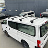 Black heavy duty roof rack 4 piece set mounted on the back of white nissan nv350 caravan 2012-current