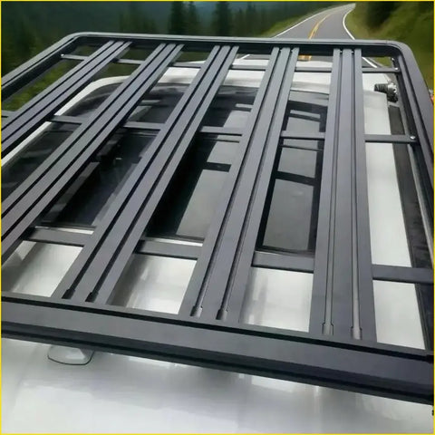 Black metal heavy duty roof rack with grid design mounted on white ford ranger 2022+ seen from back side