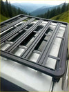 Black metal heavy duty roof rack with grid design mounted on back of white ford ranger 2022 plus vehicle