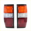 Black-framed rear tail lights with orange clear and red lens sections for mitsubishi triton l200 dodge ram 50