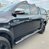 Black stainless steel 4 inch oval tube running board on black toyota hilux with chrome mirrors and black alloy wheels