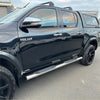 Black toyota hilux with chrome 4 inch oval tube stainless steel running board side steps and black alloy wheels