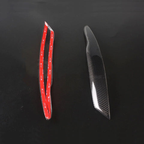 VW Passat B6 Black Carbon Fiber Headlight Eyelid Trim (2005-2010)