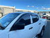 White pickup truck with black side mirrors and window trim featuring s window monsoons weather shields for volkswagen amarok 2010+