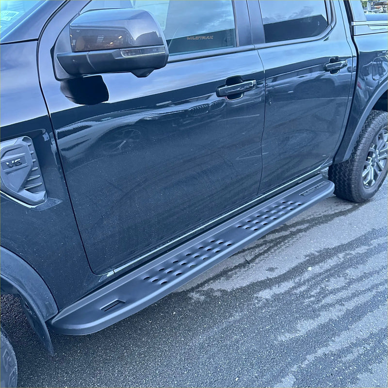Black matte side step raptor style heavy duty steel with textured perforated pattern and mounting brackets for ranger 2022+ double cab