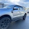 Silver ford ranger with black alloy wheels featuring heavy duty steel raptor style side steps for px1 2 3 2012-2021