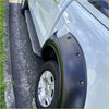 Black plastic fender flare on the back side of silver mazda bt-50 with side step running board 2012-2020