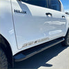 White toyota hilux double cab with black srs cruiser side steps and chrome lettering for 2015-2026 model years