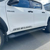 White toyota hilux double cab with black side step running boards and srs cruiser decals from 2015 to 2026 models