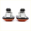 A pair of amber plastic side turn signal lights with gray connectors and black gaskets for toyota hilux 1997-2006