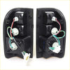 Backside of black plastic smoke led tail light assemblies with wiring for toyota hilux mk4 mk5 1997-2005 x2