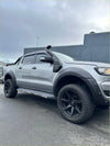 Silver ford ranger px2 px3 pickup with black wheels fender flares and roof-mounted snorkel 2016-2021 model
