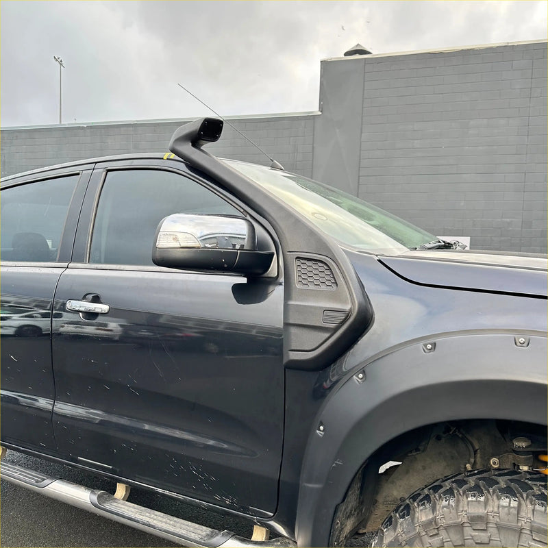 Black plastic snorkel mounted on the front of a dark gray ford ranger px2 px3 2016-2021 pickup truck