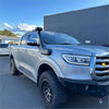 Silver metallic gwm cannon 2019-2024 pickup truck with black off-road tires and rugged front bumper featuring snorkel