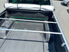 Back view of silver metal bed rack with two bars installed in truck bed under soft tonneau cover for holden colorado