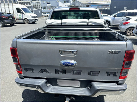 Silver ford ranger xlt pickup truck back with soft tonneau cover bed liner and roll bar for mazda bt-50 double cab