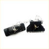 Black plastic livestock leg trap with silver chain and adjustment for mazda b series spare tire carrier back side