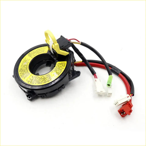 Black plastic spiral cable clock spring with yellow warning label and multicolored connectors for mitsubishi delica l400