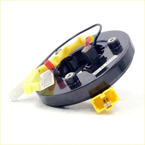 Black circular airbag pretensioner module with yellow connectors and wiring for spiral cable clock spring mitsubishi pajero montero