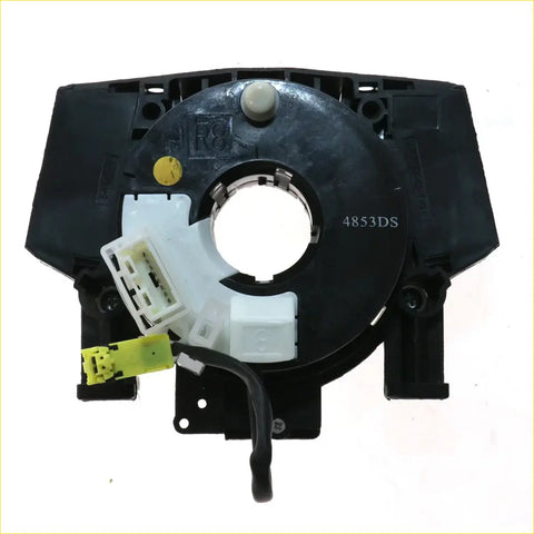 Back side of black plastic spiral cable clock spring with white and yellow connectors for nissan navara d40 airbags