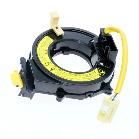 Black plastic spiral cable clock spring with yellow warning labels and connectors for toyota hilux surf 95-02 back side